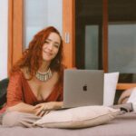 Yulia Rose using her laptio