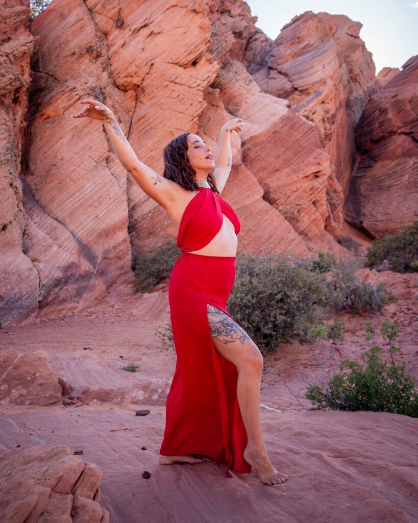 Yulia Rose in front of some rocks