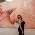 In front of some art work