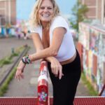 Carol leaning on a rail