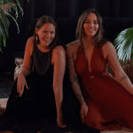 Hannah and Mahina in a candle-lit room.