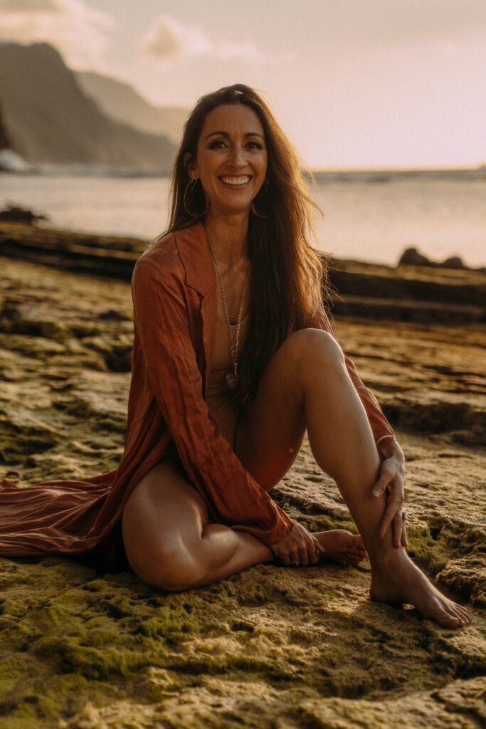 Dr Seva on the beach with a warm inviting smile.