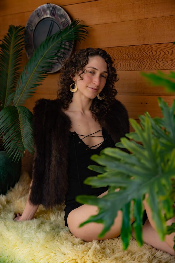 Khyla sitting with plants