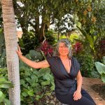 Justine in a tropical garden.