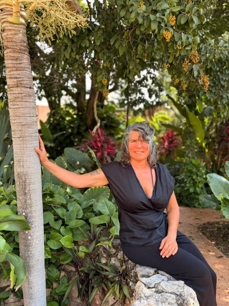 Justine in a tropical garden.