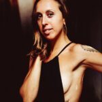 Portrait shot of Joy Shakti wearing a black top.