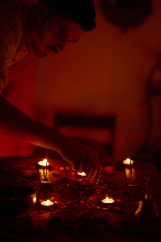 Lots of small candles on the ground.