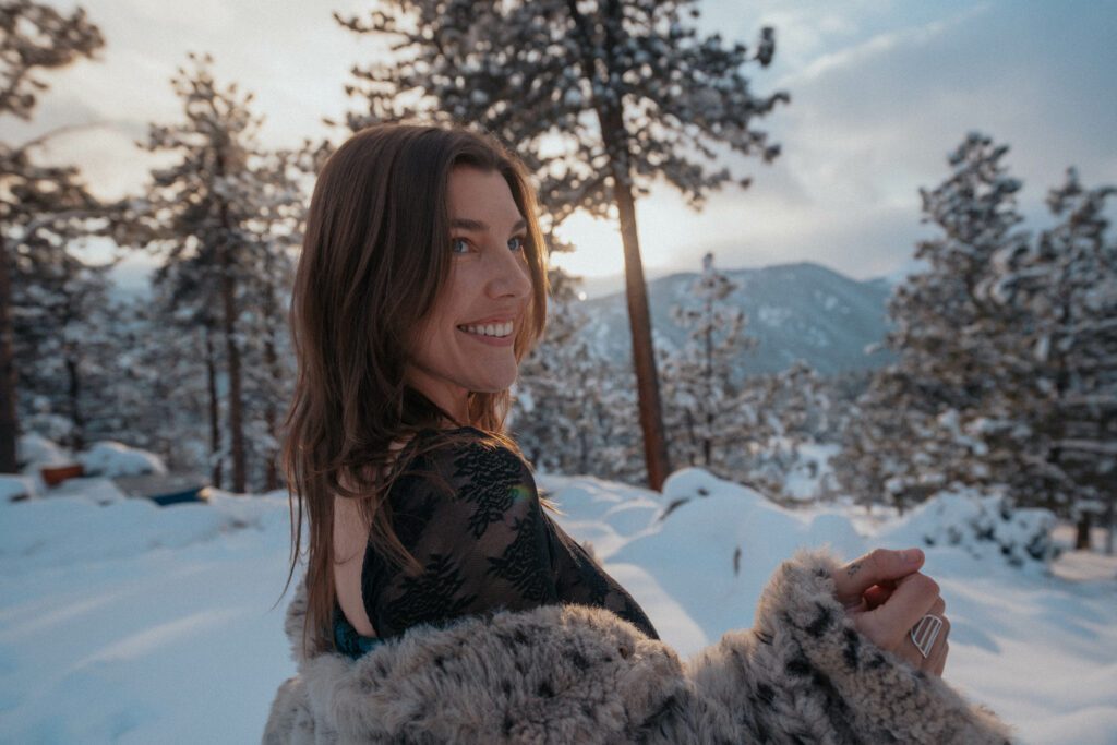 Bathing in the sun on a clear snowy day in the mountains.