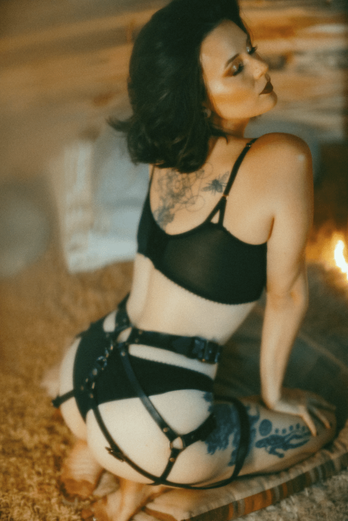Clea in lingerie from the back.