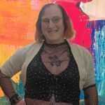 Mischa with a vibrant and colorful background.