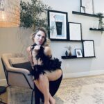 Meg in a black dress.