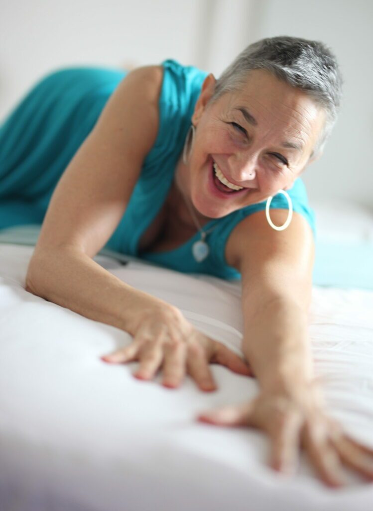 Big smile, blue dress. Luminara on the bed.