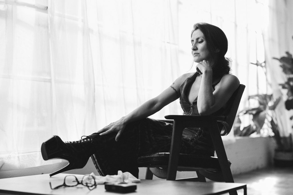 Contemplative Kalika with high heels.