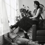 Male client on the floor. Kalika has her foot in a platform shoe on top of his chest.