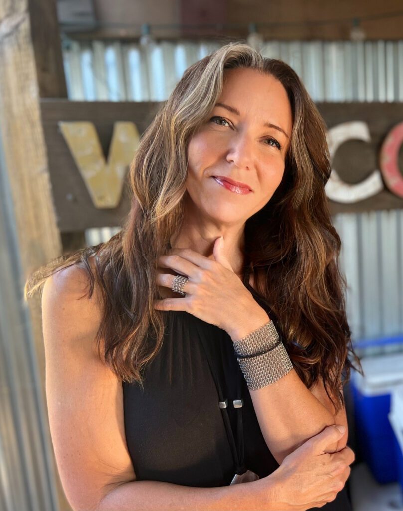 Michella with a warm smile.