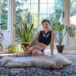 Big open space with lots of light and plants. Glory sitting on a cozy sheepskin