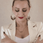 Natalia formal outfit eyes closed red lips.