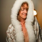 Mdame Reya Luz in a fur-front coat.