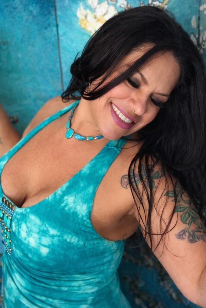 Pamela in a neon-blue dress.