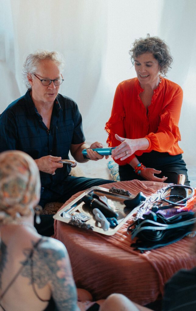 DakaDan presenting a selection of toys to a few ladies.