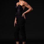 Mistress Semara in a long black dress.