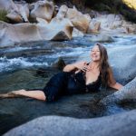 Veritie bathing in a wild river.