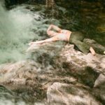 Chillin´ on a big rock next to a waterfall.