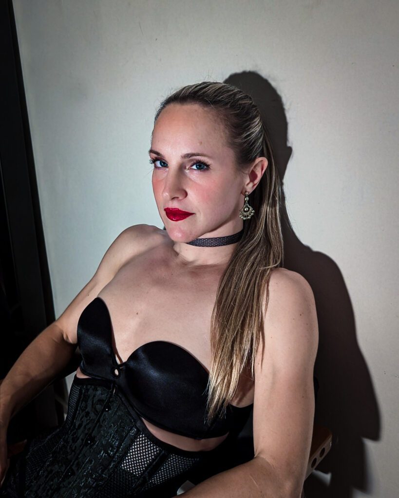 Close-up of Sadisa leaning against a wall.