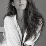 Black/white shot of Monica sitting with her hair loose.