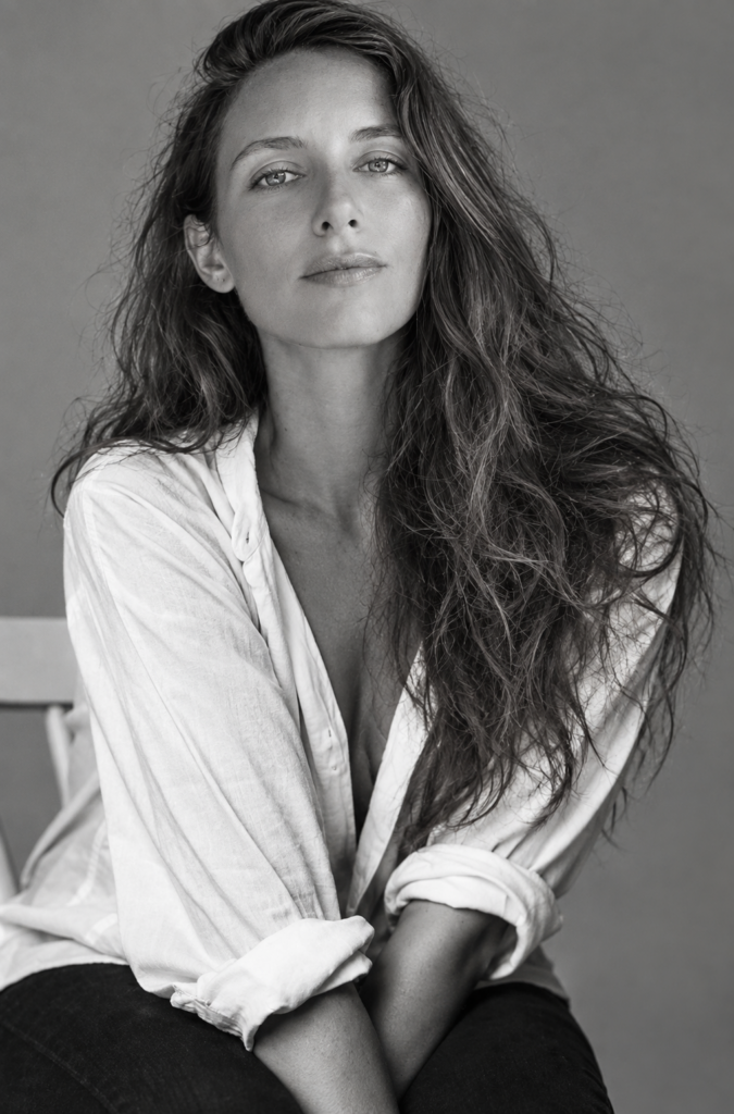 Black/white shot of Monica sitting with her hair loose.