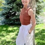 Casual LeAira standing in front of a tree with a big smile
