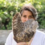 Gaia holding a birds wing.