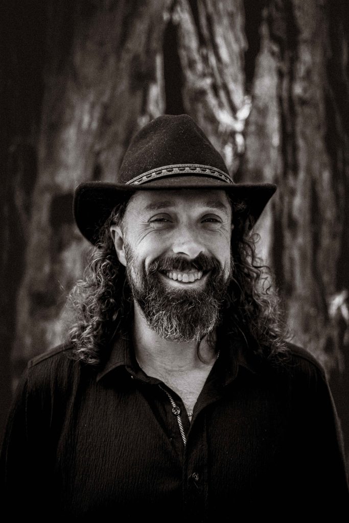 Black&white portrait of amiling Daniel.