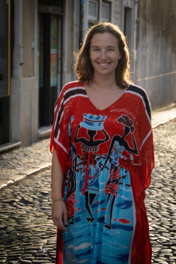 Heather on the street in a colorful dress.