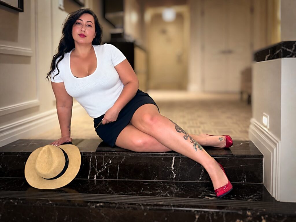 Miss Anna sitting on marbel stairs.