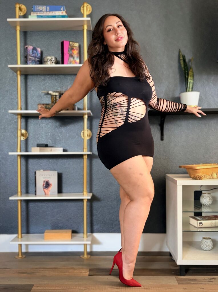 Standing next to a shelf.